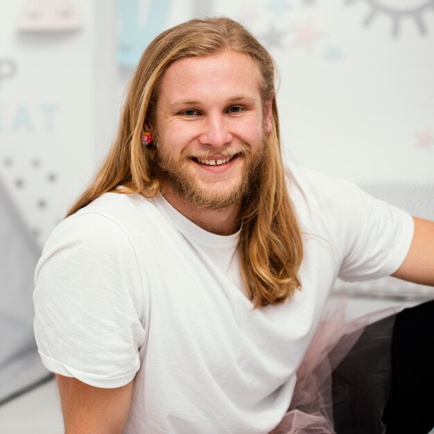 front-view-smiley-father-posing-home_23-2148853976